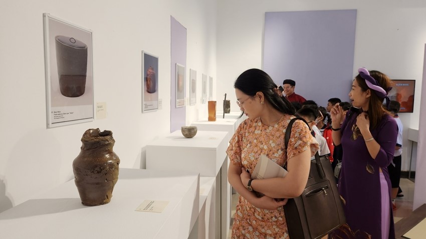 Admiring Japanese pottery