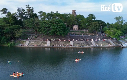Captivated by the sunset over the Huong River