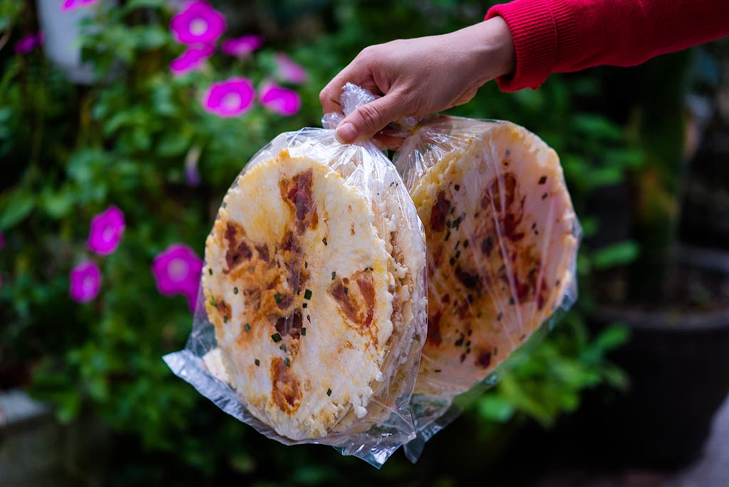 Crisp pressed cakes are packed for taking away