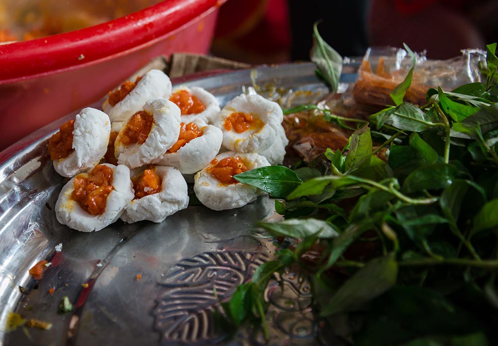 The ground meat is stirred with onions and coriander to make the filling 