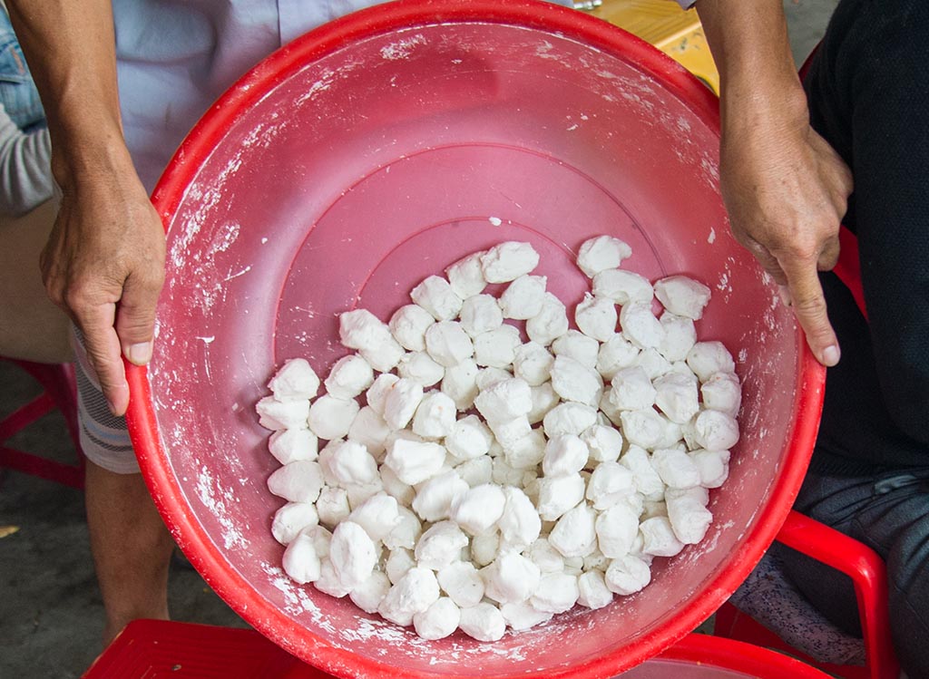 The flour is pinched into small pellets