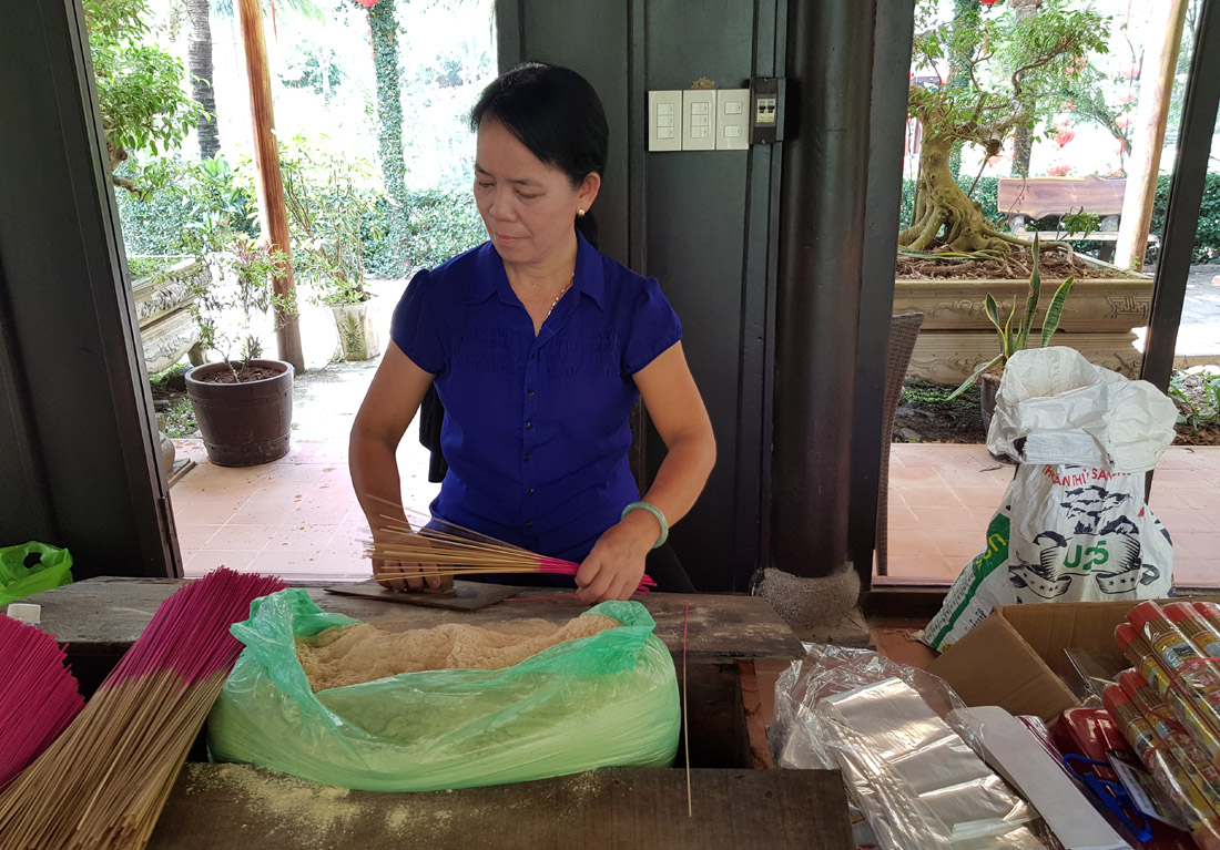 Performing the steps of making incense sticks