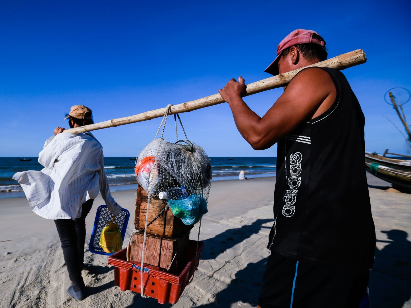They prepare the tools for Mr. Tam to go out to sea to catch cuttlefish