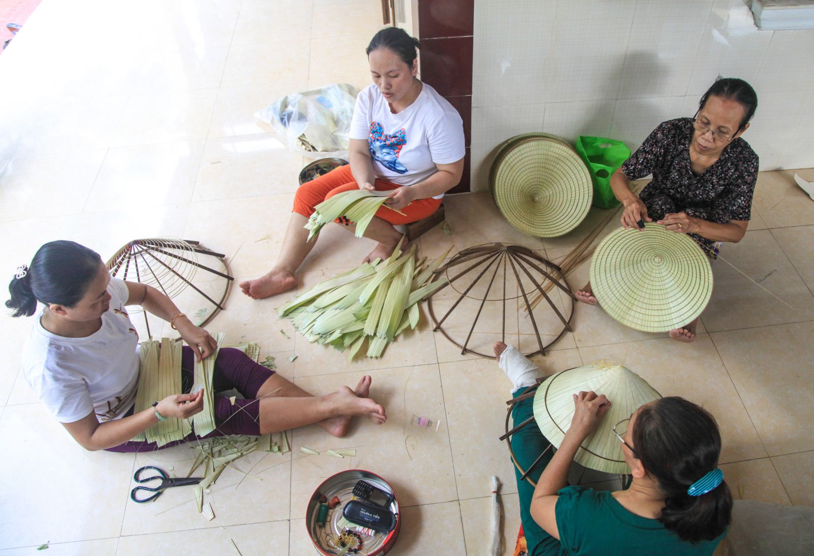 Making conical hats together