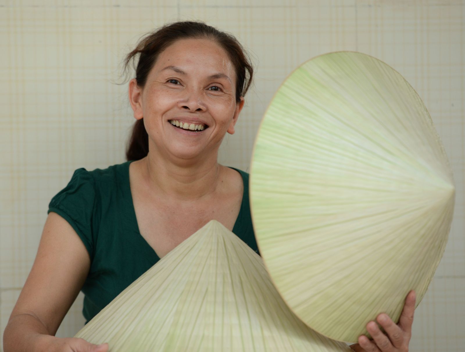 The happiness of the hat makers with their final products