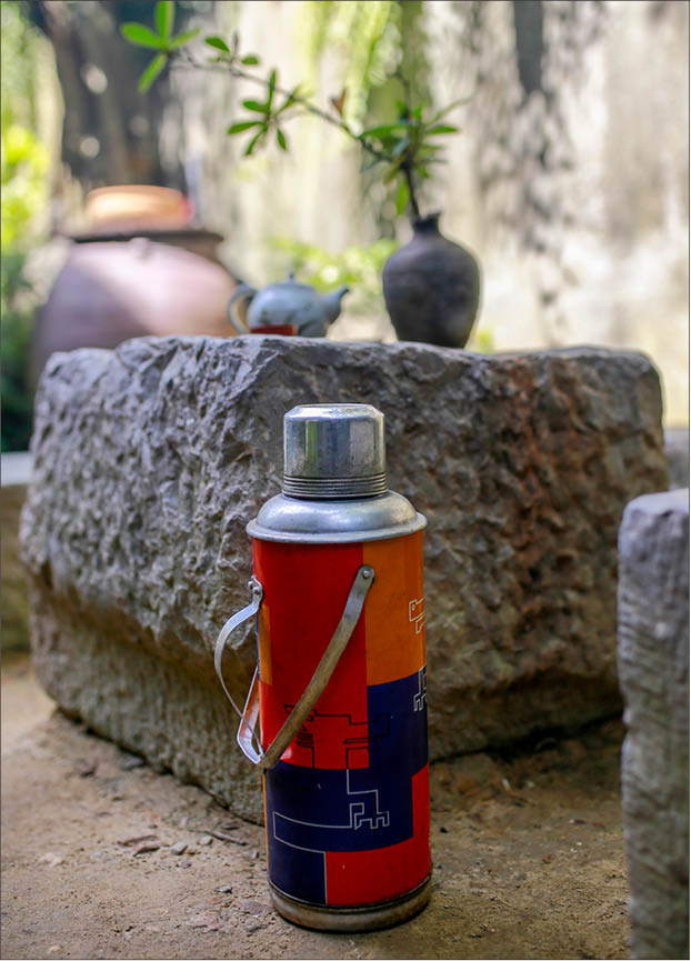 Thermos, water jars, and the familiar kitchen corner