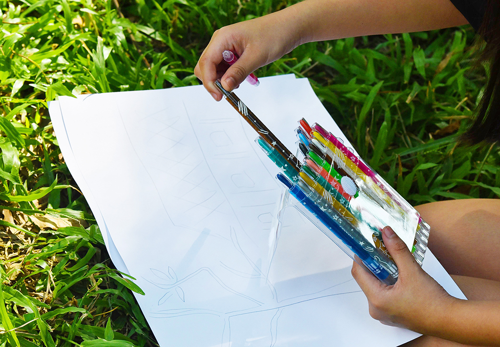 The crayons helped a student finish her vivid and beautiful painting