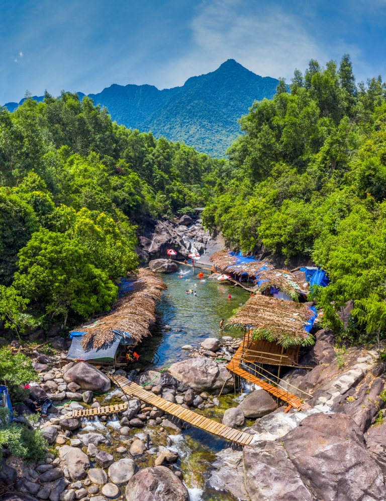 Next to the huts is a natural forest system, shading visitors who come here to explore and swim
