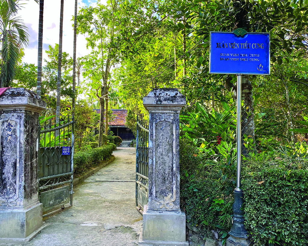 Under the sweltering sunshine, people in garden houses watering the trees regularly to avoid drought 