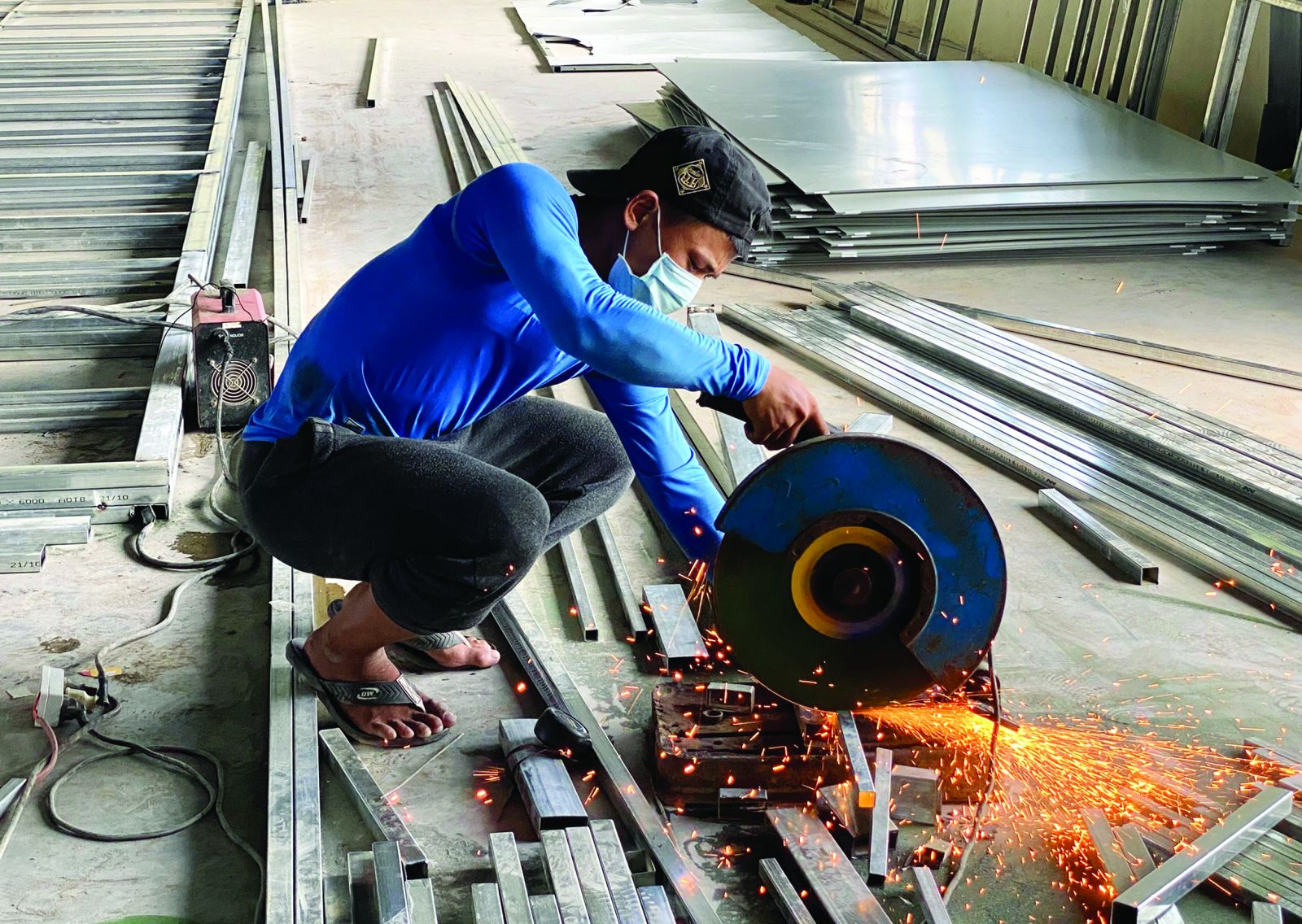 Welding and cutting iron to make partitions in treatment rooms