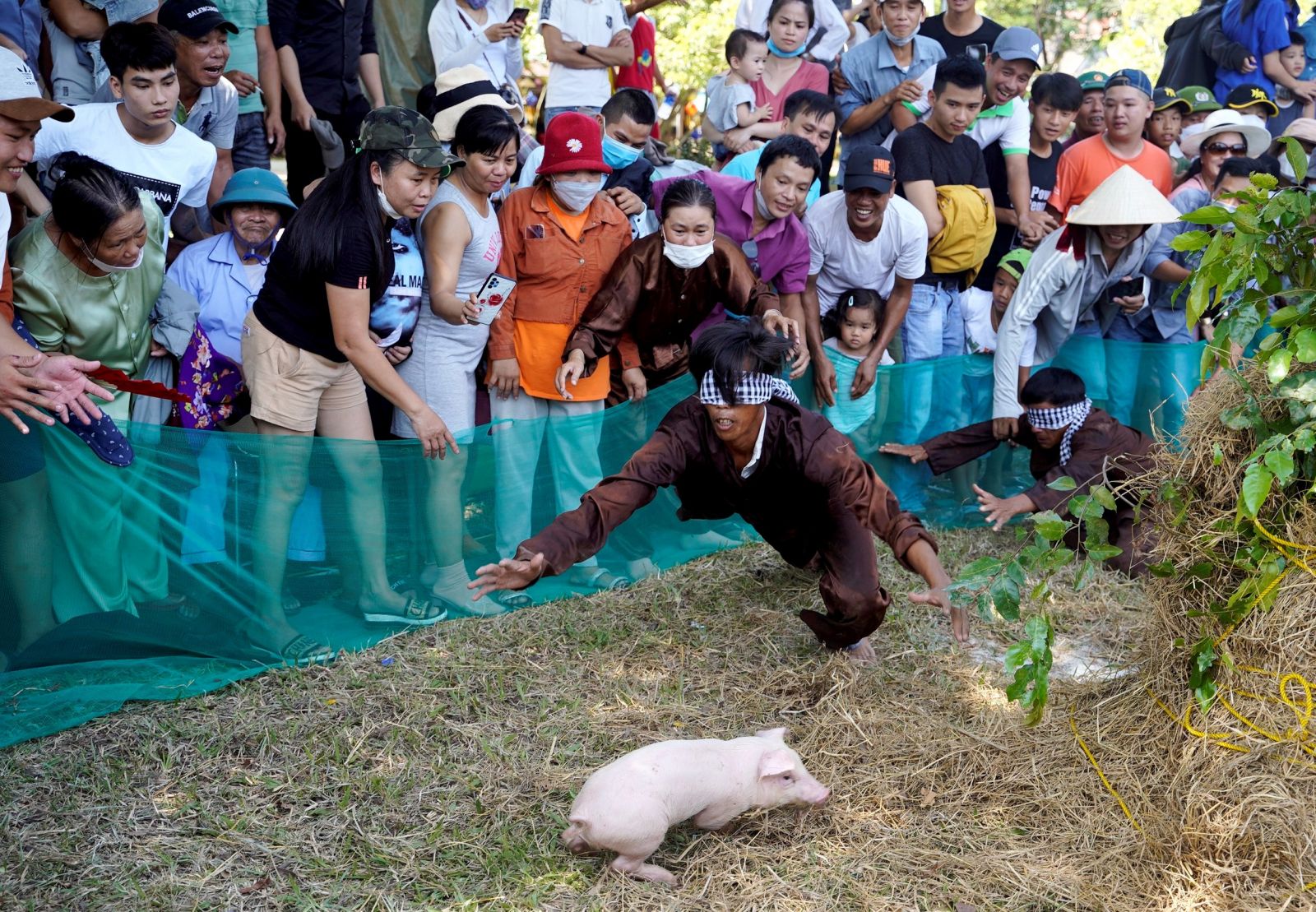 Difficult but humorous blindfold catching pig game