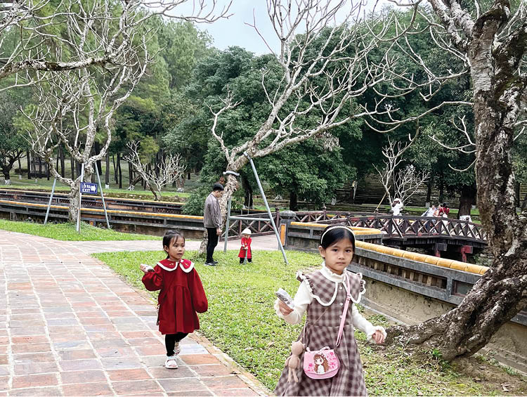 Visitors visiting Tu Duc mausoleum