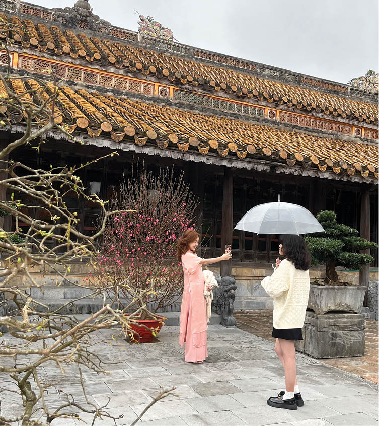 Visitors visiting Tu Duc mausoleum
