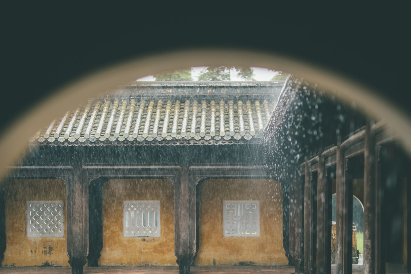 Through each door frame, we see a silver coat of rain