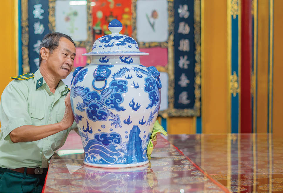The worker at Thieu Tri royal mausoleum cleaning up interiors and artifacts in the inner palace 1