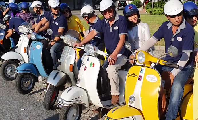 Film studio tour by antique motorbike