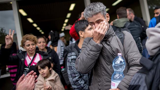 Thủ tướng Đức bảo vệ chính sách tị nạn mở cửa