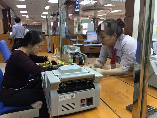 Tiếp tục cơ cấu lại tổ chức tín dụng, xử lý nợ xấu