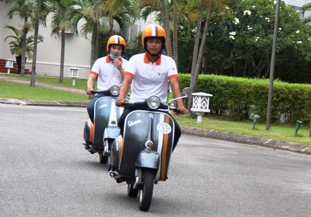 Vintage Vespa scooters paraded around Hue city
