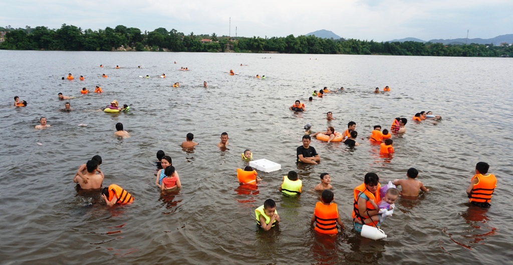 Swimming in Huong river on summer