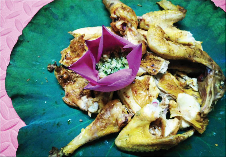 Chicken grilled on a termitarium - both familiar and strange