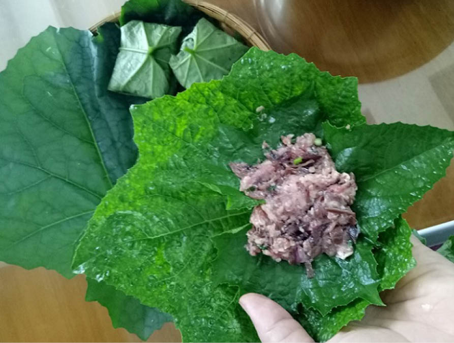 Duck sausage in loofah leaf wrap