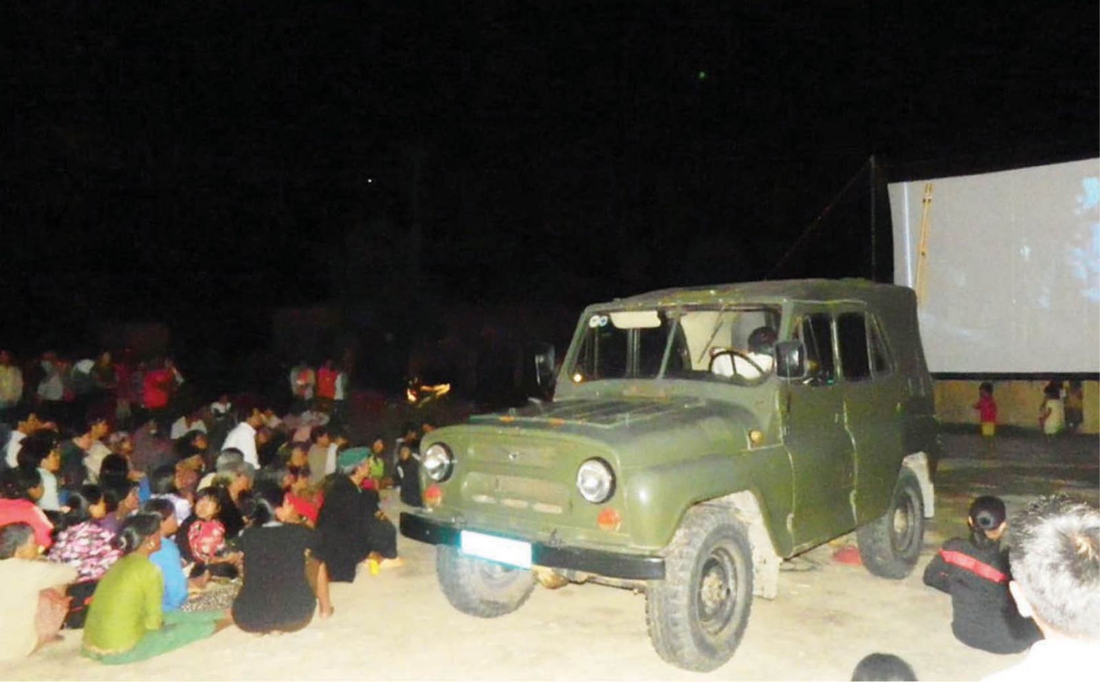 Hardship in carrying films pick-a-back” to mountain villages